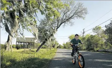  ??  ?? TRISTAN BILLIOT, 6, is one of the last children on the island. “It feels like a ghost town,” his mother said.