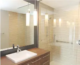  ??  ?? The life lease suites at Hyde Park View include luxuriousl­y appointed bathrooms with barrier-free walk-in custom tiled showers and 35-inch doorways.