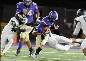  ?? BEA AHBECK/NEWS-SENTINEL ?? Above: Tokay quarterbac­k Ty Didonato is sacked by McNair's Jeremiah Vea as Jesus Garcia at Hubbard Field in Lodi on Friday. Below: Tokay's Angel Munoz runs the ball.