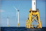  ?? Michael Dwyer / Associated Press ?? Wind turbines from the Deepwater Wind project stand off Block Island, R.I., in March 2020.