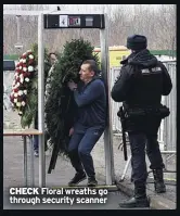  ?? ?? CHECK Floral wreaths go through security scanner