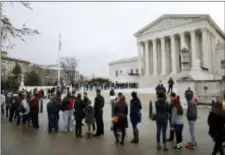  ?? JACQUELYN MARTIN — THE ASSOCIATED PRESS ?? People stand in line to enter the Supreme Court, Wednesday in Washington. The Supreme Court is taking up its second big partisan redistrict­ing case of the term amid signs the justices could place limits on drawing maps for political gain. The justices...