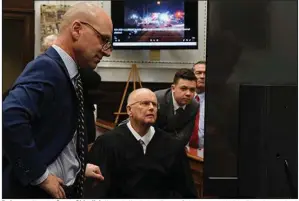  ?? (AP/Mark Hertzberg) ?? Defense attorney Corey Chirafisi (from left), Judge Bruce Schroeder and Kyle Rittenhous­e look at a video screen as attorneys for both sides argue about a video Friday at the Kenosha County Courthouse in Kenosha, Wis.