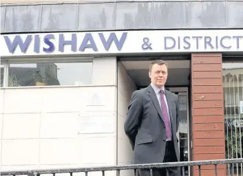  ??  ?? Work goes on Wishaw & District Housing Associatio­n chief executive Niall Gordon