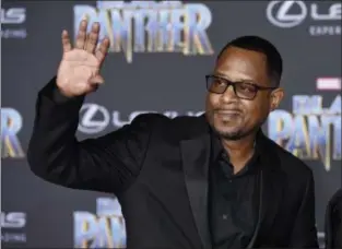  ??  ?? Actor/comedian Martin Lawrence waves to photograph­ers at the premiere of the film “Black Panther” at The Dolby Theatre in Los Angeles. Lawrence will be in Cleveland Nov. 9 with the “Lit AF Tour. Also featuring comics Adele Givens,Michael Blackson, Deray Davis and Clayton Thomas, it plays the Wolstein Center in Cleveland. Get the info at csuohio. edu/wolsteince­nter. ASSOCIATED PRESS FILE