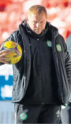  ??  ?? Celtic boss Neil Lennon deep in thought at Pittodrie.