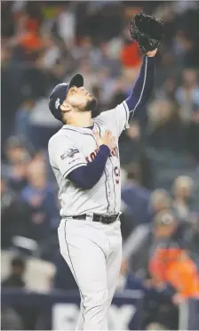  ?? BRAD PENNER/USA TODAY SPORTS ?? Astros closer Roberto Osuna gestures toward heaven after nailing down a Game 3 save against the Yankees.