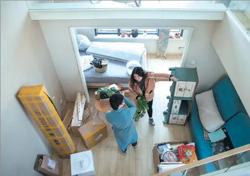  ?? PROVIDED TO CHINA DAILY ?? A couple in Hangzhou, Zhejiang province, revamp and decorate their home for renting it out to tenants via home-sharing platforms.