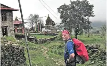  ?? G A Z E T T E
P H O T O S ( 4 ) : D AV I D YAT E S , S P E C I A L T O T H E MO N T R E A L ?? Archie Smith passes a Buddhist shrine while trekking to Everest Base Camp in Nepal.