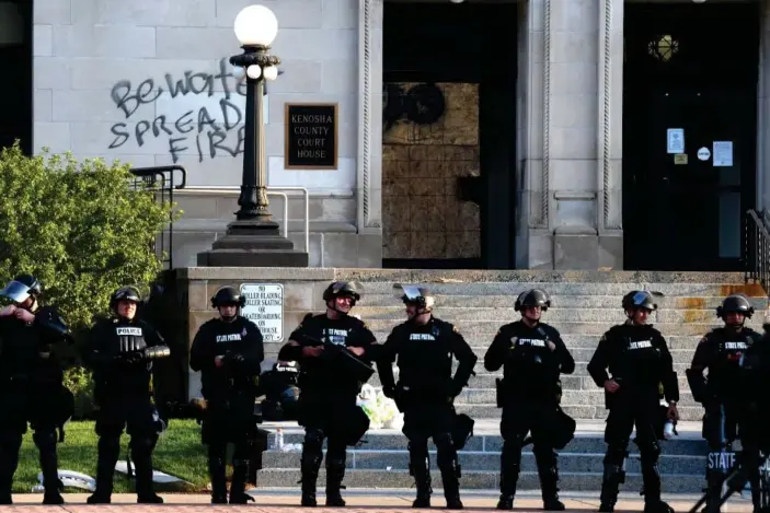  ?? Photograph: Mark Hertzberg/ZUMA Wire/REX/Shuttersto­ck ?? The shooting in Kenosha, Wisconsin led to protests outside the local police station.