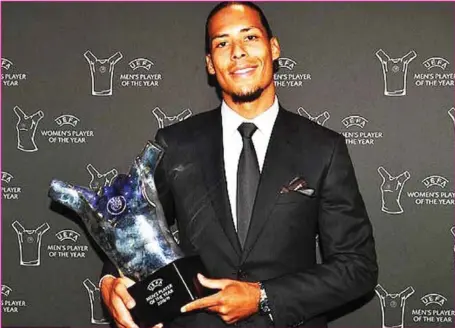  ??  ?? Virgil van Dijk with his award... yesterday