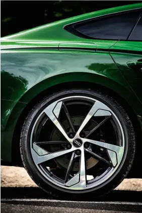  ??  ?? Above left: RS5 Sportback rides on 20-inch alloys – test car’s Anthracite black and diamond-cut versions are a no-cost option. Above right: panoramic tilting and opening glass sunroof comes as standard