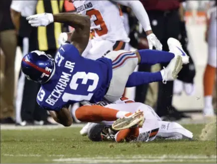  ?? DAVID RICHARD — ASSOCIATED PRESS ?? Giants wide receiver Odell Beckham is tackled by Browns strong safety Briean Boddy-Calhoun in the first half of Monday's preseason game in Cleveland.