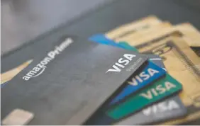  ?? AP FILE PHOTO/JENNY KANE ?? U.S. consumer borrowing fell in March for the first time in more than eight years, with the category covering credit cards dropping by the largest amount in more than three decades.