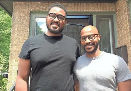  ?? TOM DAYKIN / MILWAUKEE JOURNAL SENTINEL ?? Brothers Gregory Davis, left, and David Griggs have bought and remodeled eight homes in Milwaukee's central city. They are now venturing into commercial developmen­t.