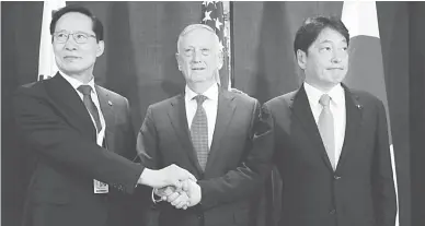  ??  ?? TRILATERAL MEETING — South Korea’s Defense Minister Song Young-moo, US Secretary of Defense Jim Mattis and Japan’s Defense Minister Itsunori Onodera attend a trilateral meeting on the sidelines of the IISS Shangri-la Dialogue in Singapore June 3, 2018....