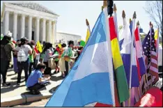  ?? KEITH LANE / MCCLATCHY ?? Thousands of demonstrat­ors rallied in Washington, D.C., last month outside the U.S. Supreme Court in support of laws that make it easier for immigrants to enter the country.