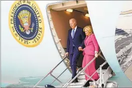  ?? Stephanie Scarbrough Associated Press ?? PRESIDENT BIDEN and First Lady Jill Biden arrive on Air Force One at Los Angeles Internatio­nal Airport on Feb. 3. Polls show a tight race for reelection.