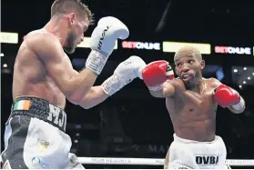  ?? /Getty Images ?? Azinga Fuzile and Martin J Ward battle during their IBF super featherwei­ght title clash in May in Las Vegas.