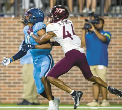  ?? MIKE CAUDILL/FREELANCE ?? Wide receiver Ali Jennings III, left, shown waiting for a long pass as he is defended by Virginia Tech defensive back Dorian Strong last season, played a big role in Old Dominion’s season-opening upset victory. Now, Jennings is with the Hokies.