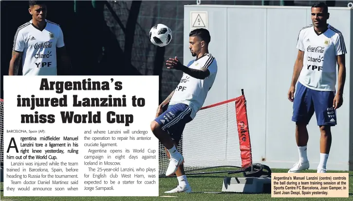  ??  ?? Argentina’s Manuel Lanzini (centre) controls the ball during a team training session at the Sports Centre FC Barcelona, Joan Gamper, in Sant Joan Despi, Spain yesterday.