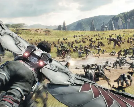  ?? PHOTOS: DISNEY ?? Falcon, portrayed by Anthony Mackie, flies over a Wakandan battlefiel­d in the lengthy Avengers: Infinity War.