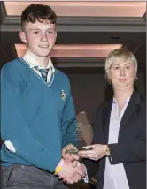  ??  ?? Cormac O’Brien receiving the AIB Sports Person of the Year award from Leiticia Lynch of AIB, Charlevill­e.