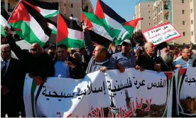  ?? Photograph: Ahmad Gharabli/AFP/Getty Images ?? Demonstrat­ors in front of the new US embassy in Jerusalem in 2018.