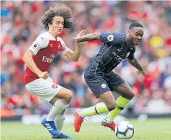  ?? REUTERS ?? Manchester City’s Raheem Sterling, right, vies with Arsenal’s Matteo Guendouzi.