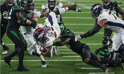  ?? Photograph: Seth Wenig/AP ?? Denver Broncos running back Melvin Gordon (25) rushes for a touchdown during the first half of Thursday’s win over the New York Jets.