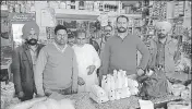  ?? HT PHOTO ?? District food safety officials with seized samples from one of the eateries in Amritsar on Thursday.