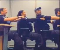  ??  ?? ANTICS: Officers go ‘rowing’ in chairs across their station, and a policeman shows off his gymnastic ability