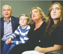  ?? BLAIR GABLE/REUTERS ?? Conservati­ve Leader Erin O'toole, along with wife Rebecca and children Jack and Mollie, watch early election results in Oshawa, Ont., on Monday night.