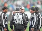  ?? VINCENT CARCHIETTA/USA TODAY SPORTS ?? Referee Brad Allen, center, huddles with other officials during a Dec. 10 game between the Jets and the Texans.