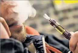  ??  ?? Blowing smoke: Gov. Cuomo and the Legislatur­e would like to make harder for this New York “vaper,” but they’re misreading the data.