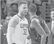  ?? Mark J. Terrill / Associated Press ?? The Clippers’ Blake Griffin (32) and Rockets’ Trevor Ariza didn’t let their play do all the talking Monday.