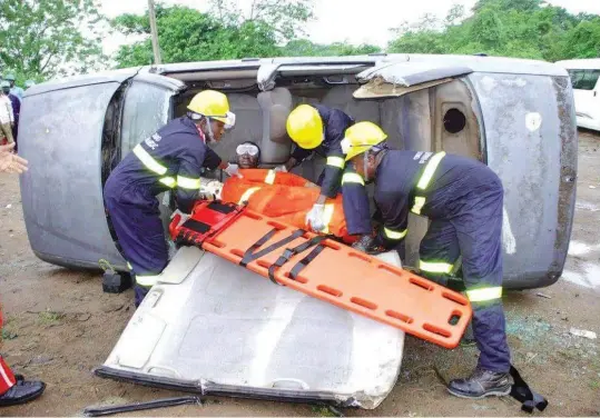  ??  ?? Staff of Ondo Emergency Medical Services Agencies (ODEMSA) rescuing an accident victim in Akure recently PHOTO: OLUWASEUN AKINGBOYE