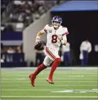  ?? Matt Patterson / Associated Press ?? Giants quarterbac­k Daniel Jones looks to pass as he rolls out against the Cowboys on Nov. 24 in Arlington, Texas.