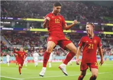  ?? Reuters ?? ■ Spain’s Marco Asensio celebrates scoring his side’s second goal against Costa Rica with teammate Dani Olmo.