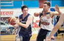  ??  ?? Eye on prize: Benalla’s Lachlan Thompson keeps his eye on the ball as Shepparton’s Nathan Grace takes it down the court.Picture: Rodney Braithwait­e