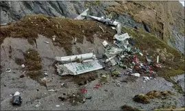  ?? FISHTAIL AIR VIA AP ?? The wreckage of a plane is scattered on the side of a Himalaya mountain gorge in Sanosware, near the mountain town of Jomsom, west of Kathmandu, Nepal, on Monday.