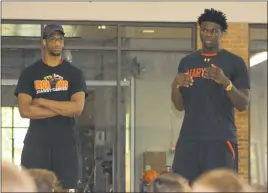  ?? STAFF PHOTO BY MICHAEL REID ?? University of Maryland men’s basketball players Justin Jackson, left, and Sean Obi talk to the players at the Chris Harney Basketball School at St. Mary’s College of Maryland.