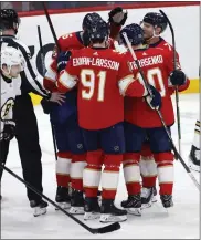  ?? RHONA WISE — THE ASSOCIATED PRESS ?? The Florida Panthers celebrate center Evan Rodrigues goal against Boston Bruins goaltender Jeremy Swayman during the first period Tuesday in Sunrise, Fla.