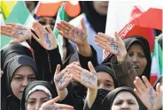  ?? Ebrahim Noroozi / Associated Press ?? Women show their support for Supreme Leader Ayatollah Ali Khamenei at a rally in Tehran.