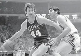  ?? FRED JEWELL/AP ?? The Boston Celtics' Paul Westphal drives past the Chicago Bulls' Jerry Sloan during a 1975 game. Westphal is among the finalists for the Basketball Hall of Fame's 2019 class.