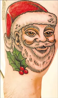  ??  ?? Stuart had Santa tattooed on his arm after raising more than £1,000 for the Lord Mayor’s Christmas Gift Fund