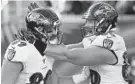  ?? GARY LANDERS/AP ?? Ravens tight end Mark Andrews, left, is congratula­ted after scoring a touchdown in the first half Sunday against Cincinnati.