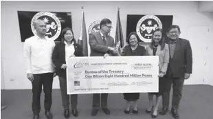  ?? CREDIT: Clark Developmen­t Corp. (CDC) ?? This March 26, 2024, photo shows Clark Developmen­t Corp. President and CEO Agnes VST Devanadera (third from the right) and Chairman Edgardo D. Pamintuan (rightmost) presenting a cheque amounting to P1.8 billion, representi­ng CDC’S cash dividends contributi­on to the National Treasurybu­reau of the Treasury to Finance secretary Ralph G. Recto (3rd from the left). Recto was accompanie­d by National Treasurer sharon P. Almanza (2nd from the right), Deputy Treasurer Erwin D. santa Ana (leftmost), and Finance Undersecre­tary Catherine L. Fong.