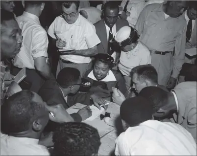  ?? PHOTO COURTESY OF THE BETTMANN ARCHIVE ?? Mamie Till talks to the Black press corps at the Tallahatch­ie County Courthouse in Sumner, Miss., during the trial of two men accused of killing her son, Emmett Till, in 1955. The men were found not guilty. This is among the photos on the life and death of the 14-yearold boy on display at the California Museum of Photograph­y in Riverside.