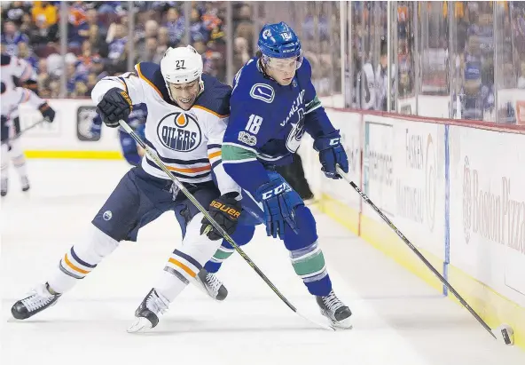  ?? — GETTY IMAGES FILES ?? Abbotsford’s Jake Virtanen, right, has played hard for the Vancouver Canucks against the likes of Milan Lucic and the Edmonton Oilers so far this season after enduring a couple tough years to begin his profession­al career for his hometown club.